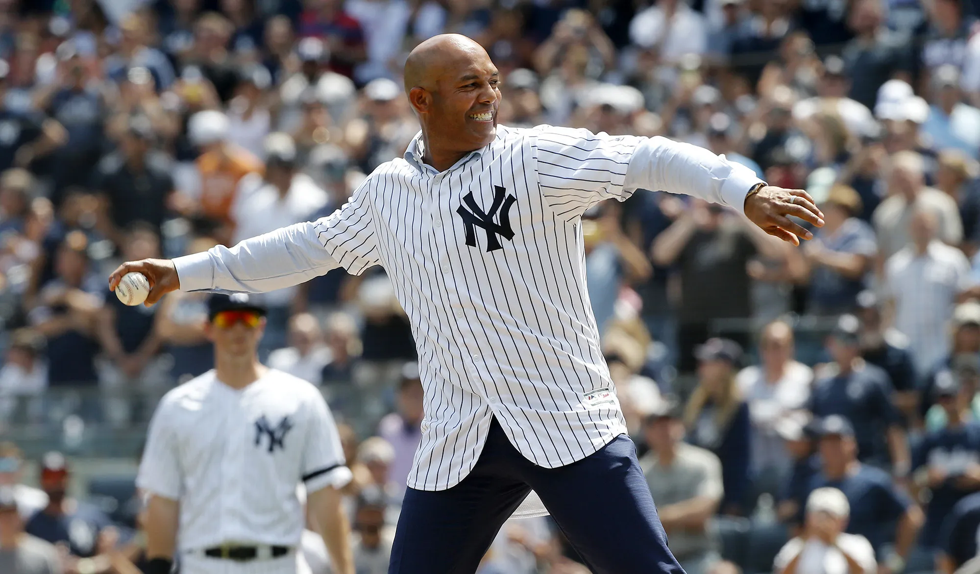 Mariano Rivera throws the ceremonial first pitch before a game in New York on Aug. 17.