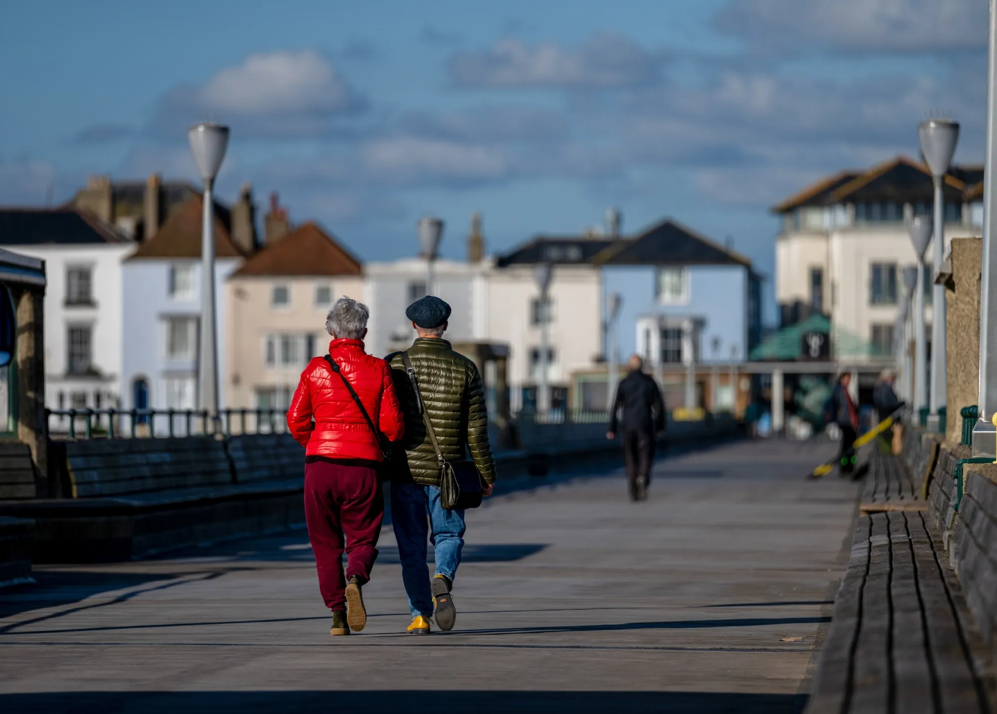 Pensioners walk along the pier in Deal, UK.