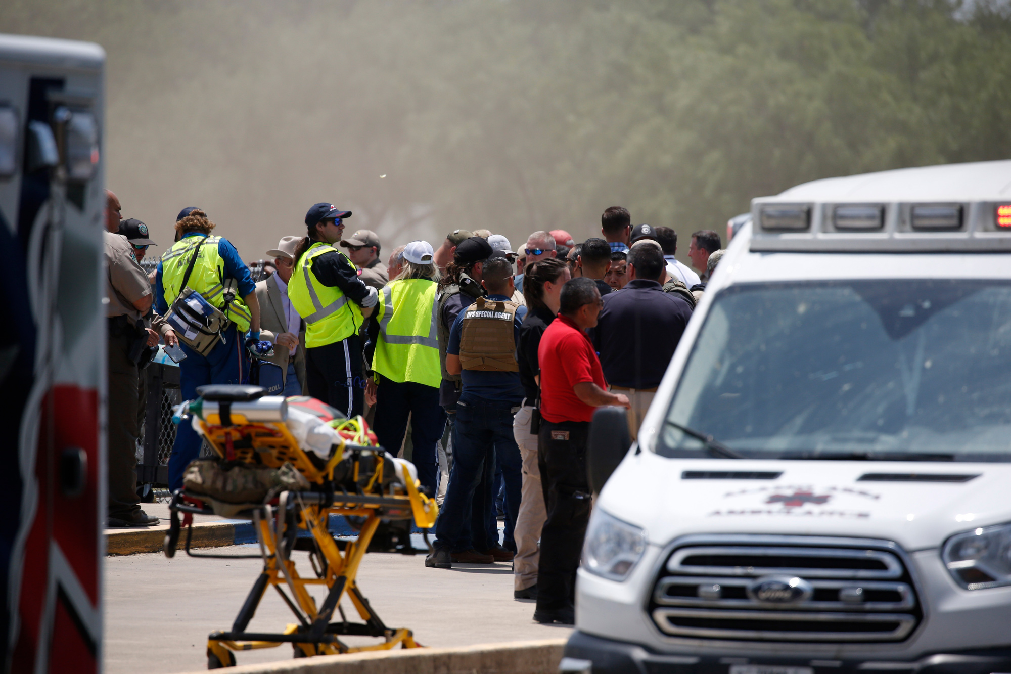 Emergency personnel gathered outside Robb Elementary School on May 24&nbsp;in Uvalde, Texas. Parents of children in the school said they pleaded with police to confront the gunman, but police delayed for an hour and 18 minutes and kept parents from going in themselves. One official reportedly said the delay was to avoid injury to police. Nineteen children and two teachers were shot dead.