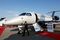 An attendee walks past an Embraer SA Legacy 500 jet on display at the Singapore Airshow held at the Changi Exhibition Centre in Singapore. Photographer: SeongJoon Cho/Bloomberg