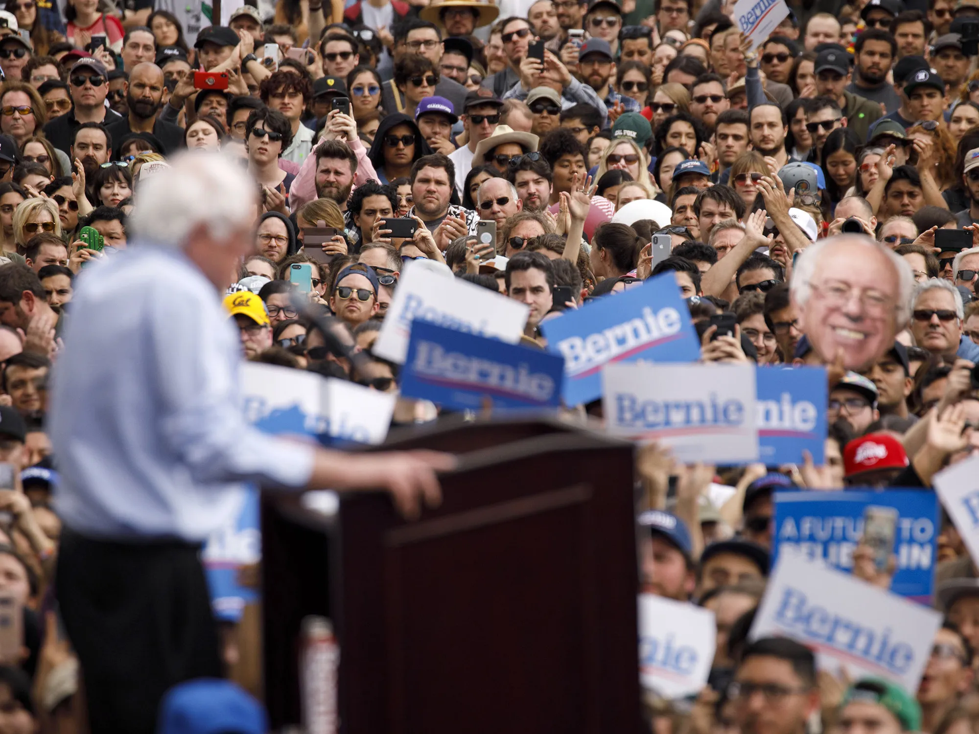 Attendees listen as Senator Bernie Sanders, an Independent from Vermont and 2020 presidential candidate, speaks during a campaign rally in Los Angeles on March 23, 2019.