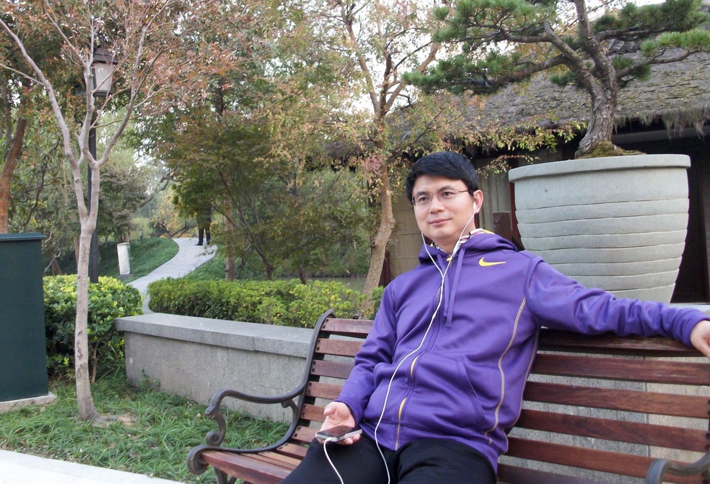 Xiao Jianhua sits on a park bench in Beijing in this undated photo.