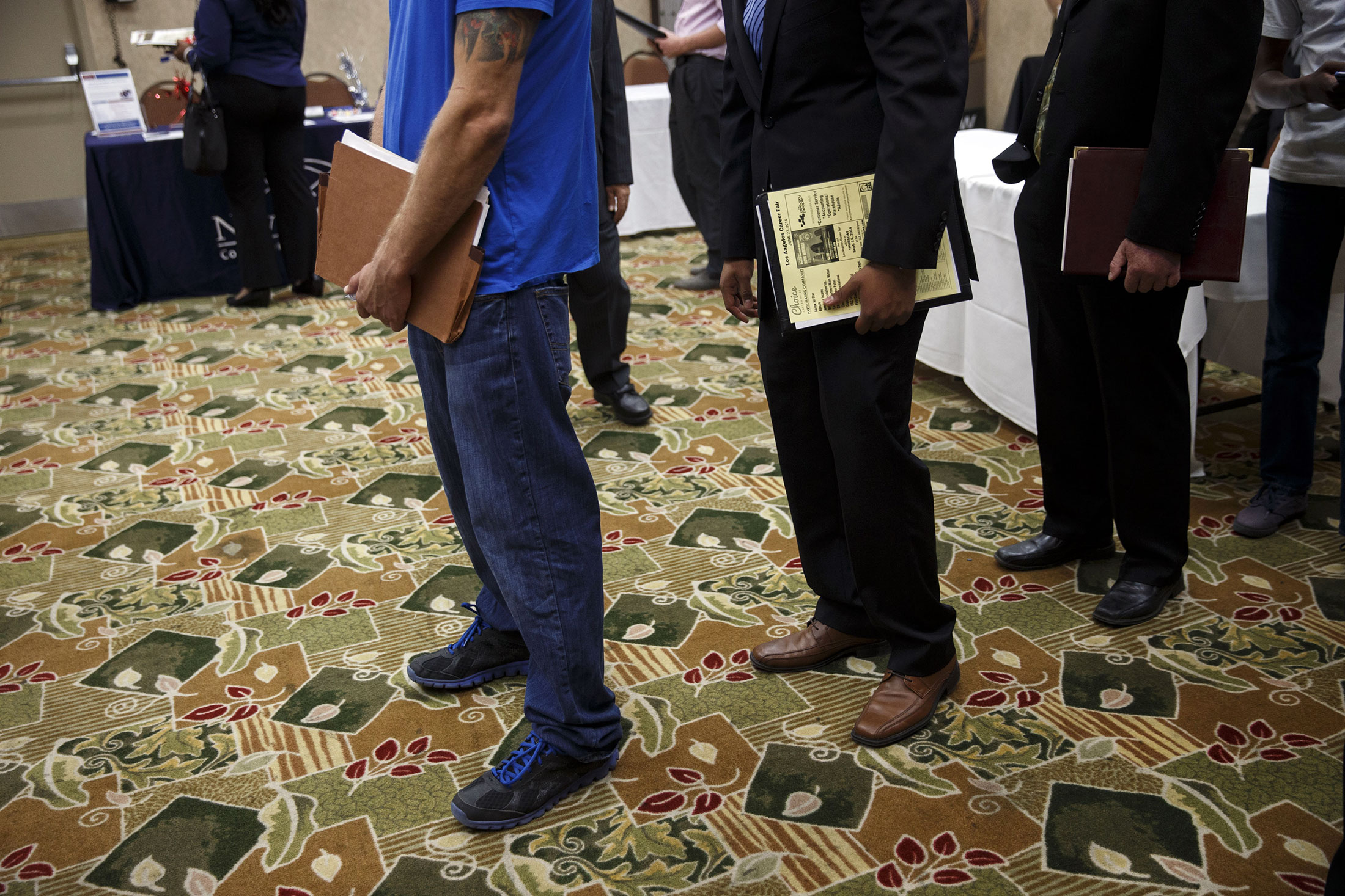 Job seekers wait in line to speak with representatives during a Choice Career Fair in Los Angeles, California, U.S., on Wednesday, June 22, 2016. The U.S. Department of Labor is scheduled to release initial jobless claims figures on June 23.
