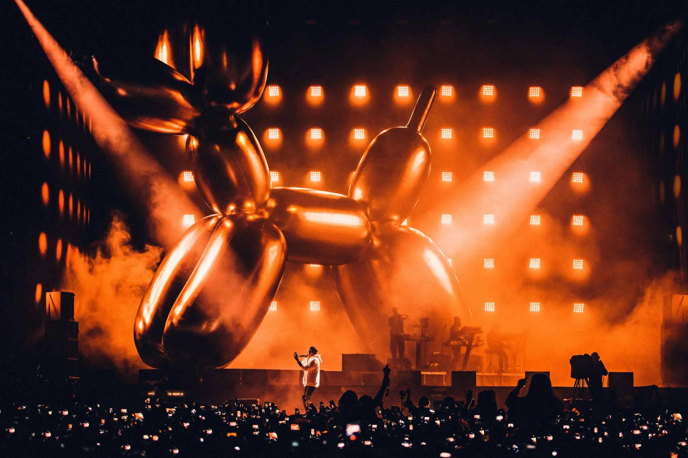 Jay-Z performs at the V Festival in front of a Jeff Koons balloon dog sculpture in August 2017.