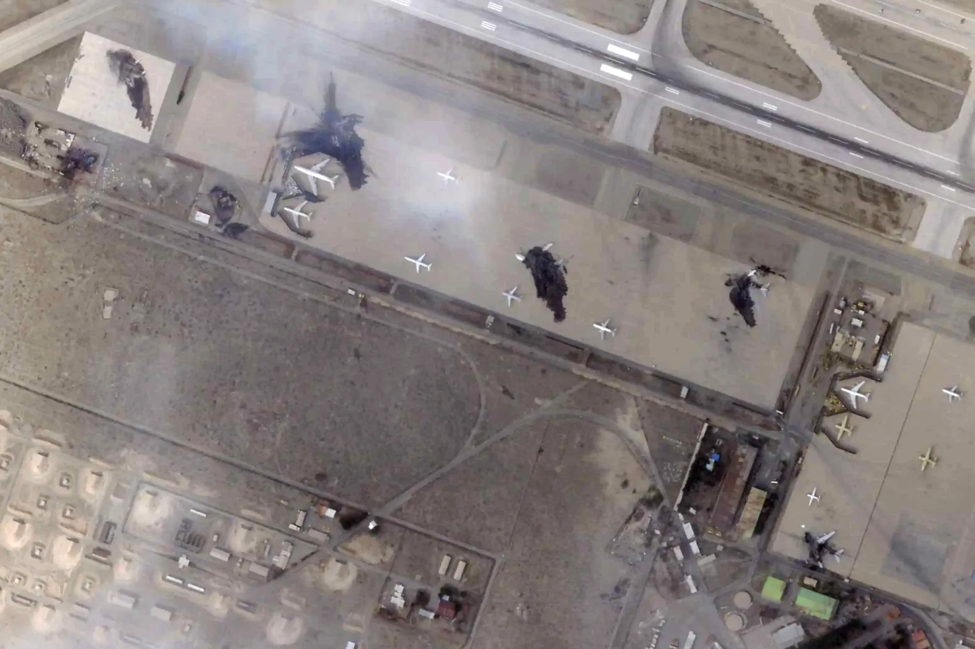 This satellite image shows damage after airstrikes targeting Mehrabad International Airport in Tehran, Iran, March 7.