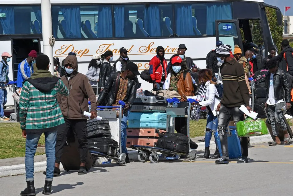 Migrants arrive at Tunis-Carthage International airport on March 7.
