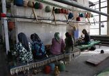 Uigur Women Weave Carpets In Hetian Carpet Factory