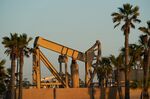 A pumpjack extracts crude oil from active oil wells at the Synergy Oil Field&nbsp;in Seal Beach, California.