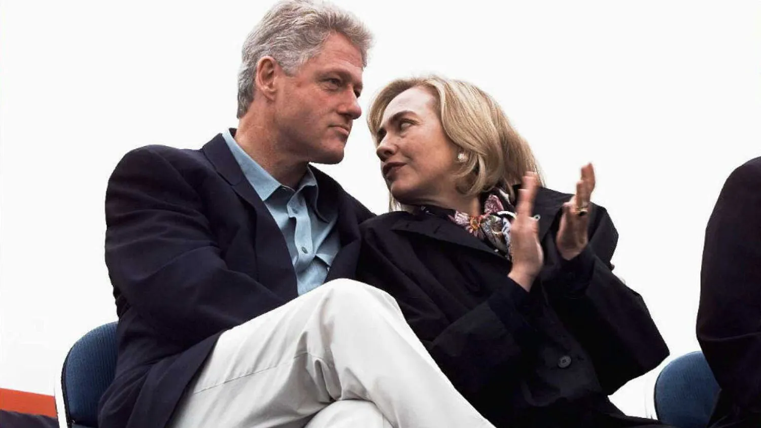 SEATTLE, WA - SEPTEMBER 19: First Lady Hillary Clinton (R), talks to US President Bill Clinton 19 September during a rally in Tacoma, Washington. The Clintons and Gores are campaigning by bus across Washington and Oregon.
