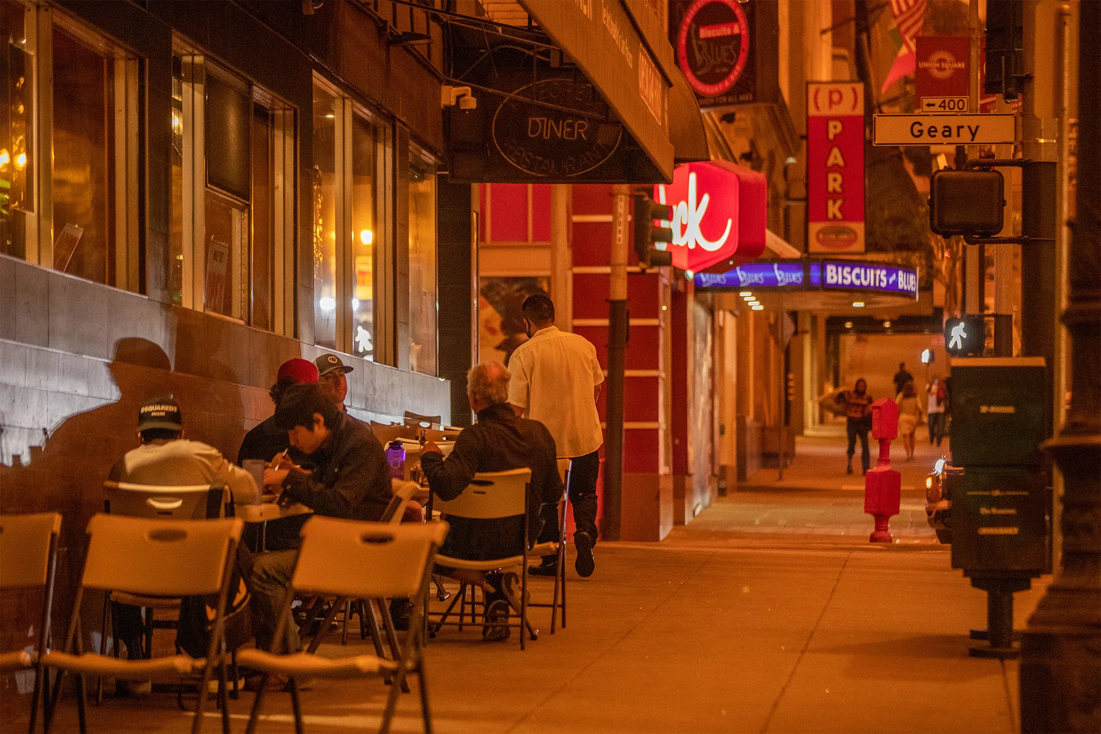 Patrons have lunch outside a restaurant in San Francisco on Sept. 9.
