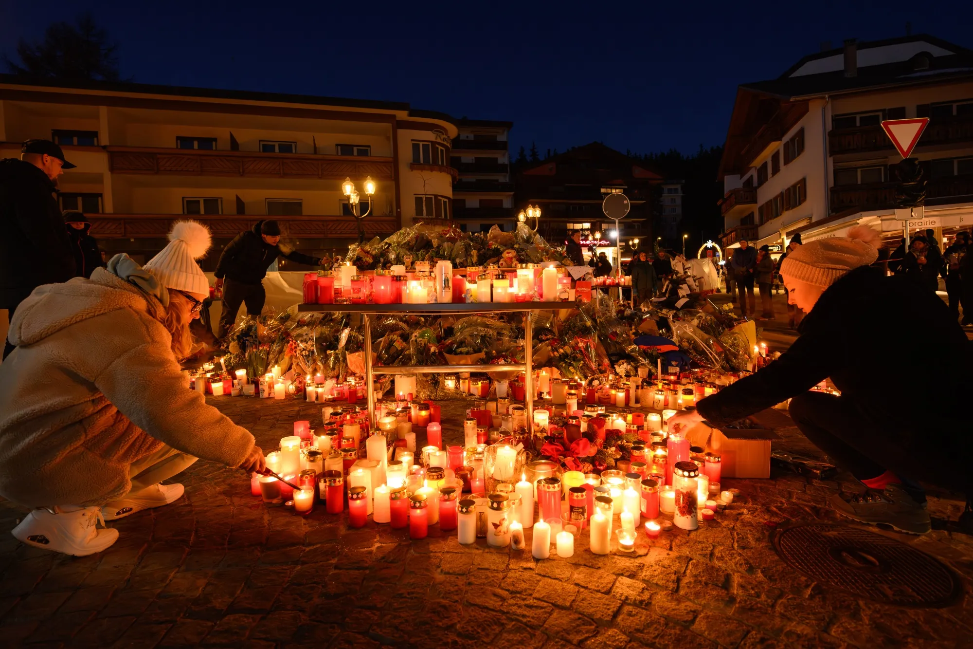 Mourners light candles in Crans-Montana, Switzerland on Jan. 3.
