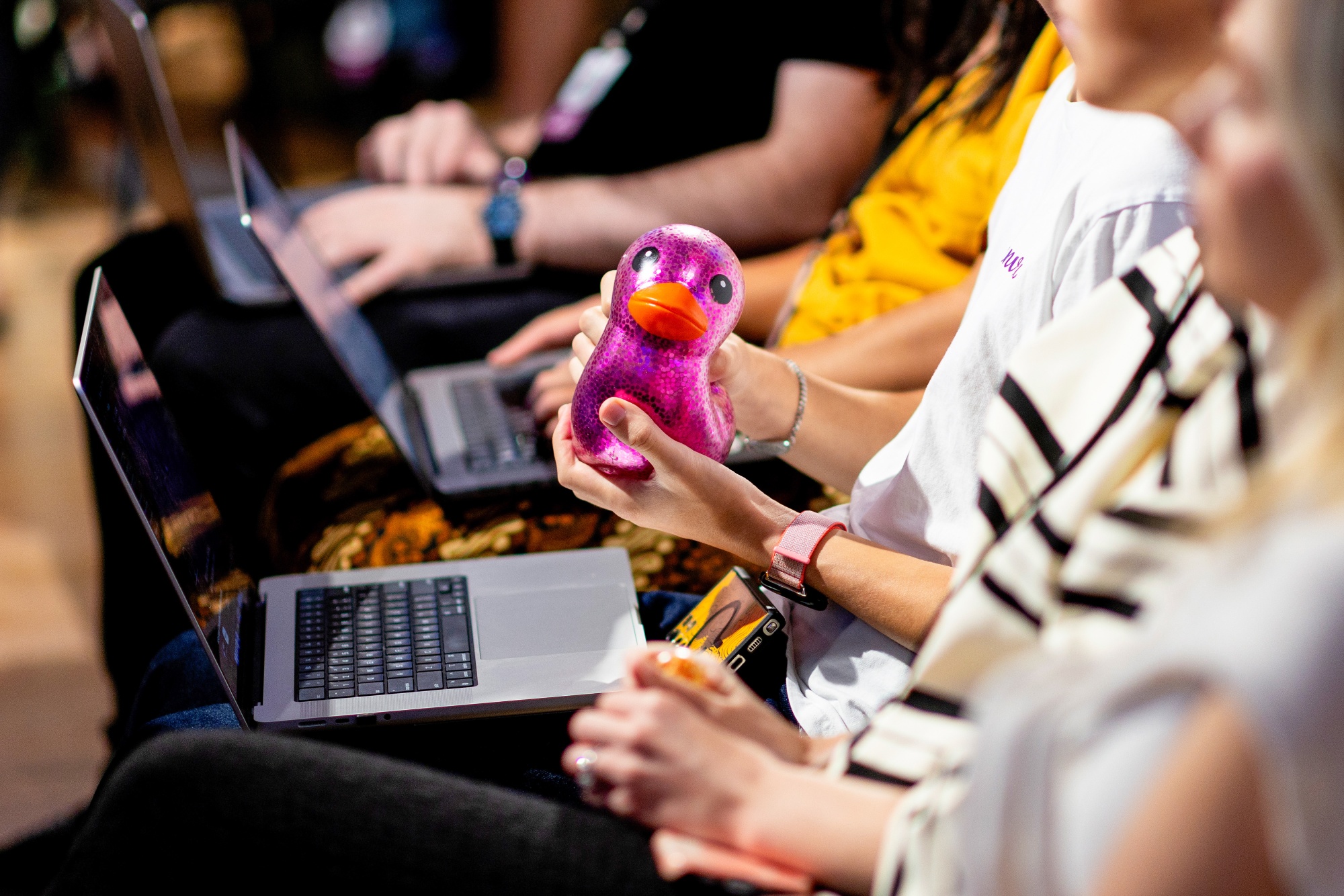 An employee holds a rubber duck during a Canva AI demonstration at he headquarters of Canva Inc., in Sydney, Australia, on Thursday, Apr. 2, 2026. Photographer: Brendon Thorne/Bloomberg