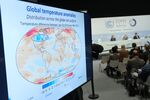 A slide shows global temperature anomalies during a presentation of data by the World Meteorological Association at the UNFCCC COP25 climate conference