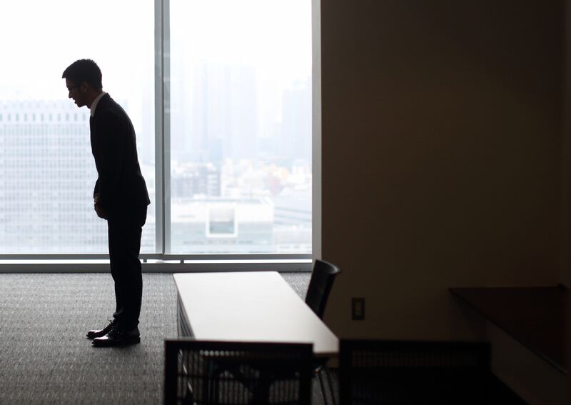 A student bows at a job fair in Tokyo. Photographer: Tomohiro Ohsumi/Bloomberg