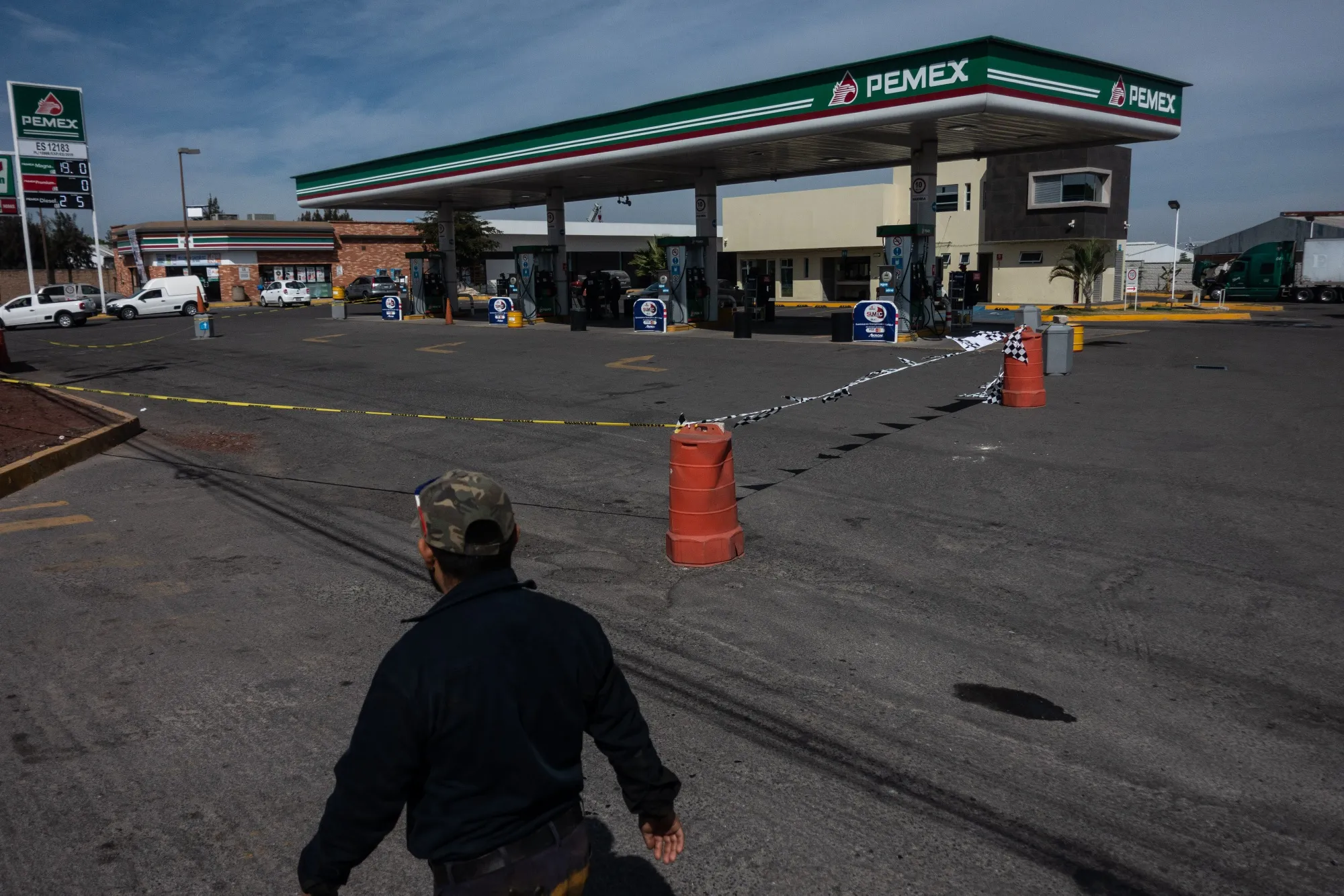 A pedestrian passes in front of a closed Pemex gas station amid a fuel shortage in Zapopan, Mexico, on Jan. 7, 2018.