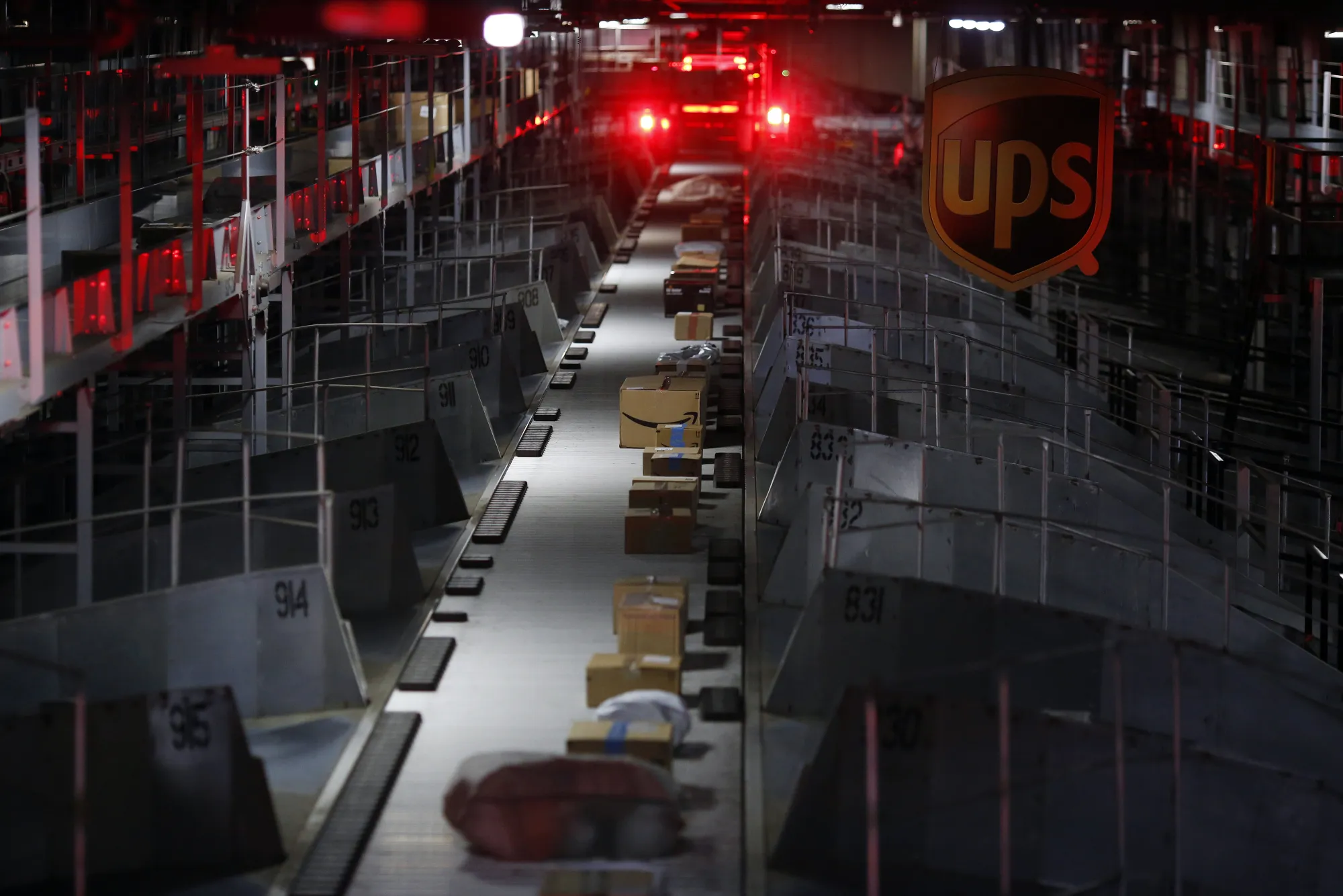 Packages move along a conveyor belt at the United Parcel Service Inc. (UPS) Chicago Area Consolidation Hub.