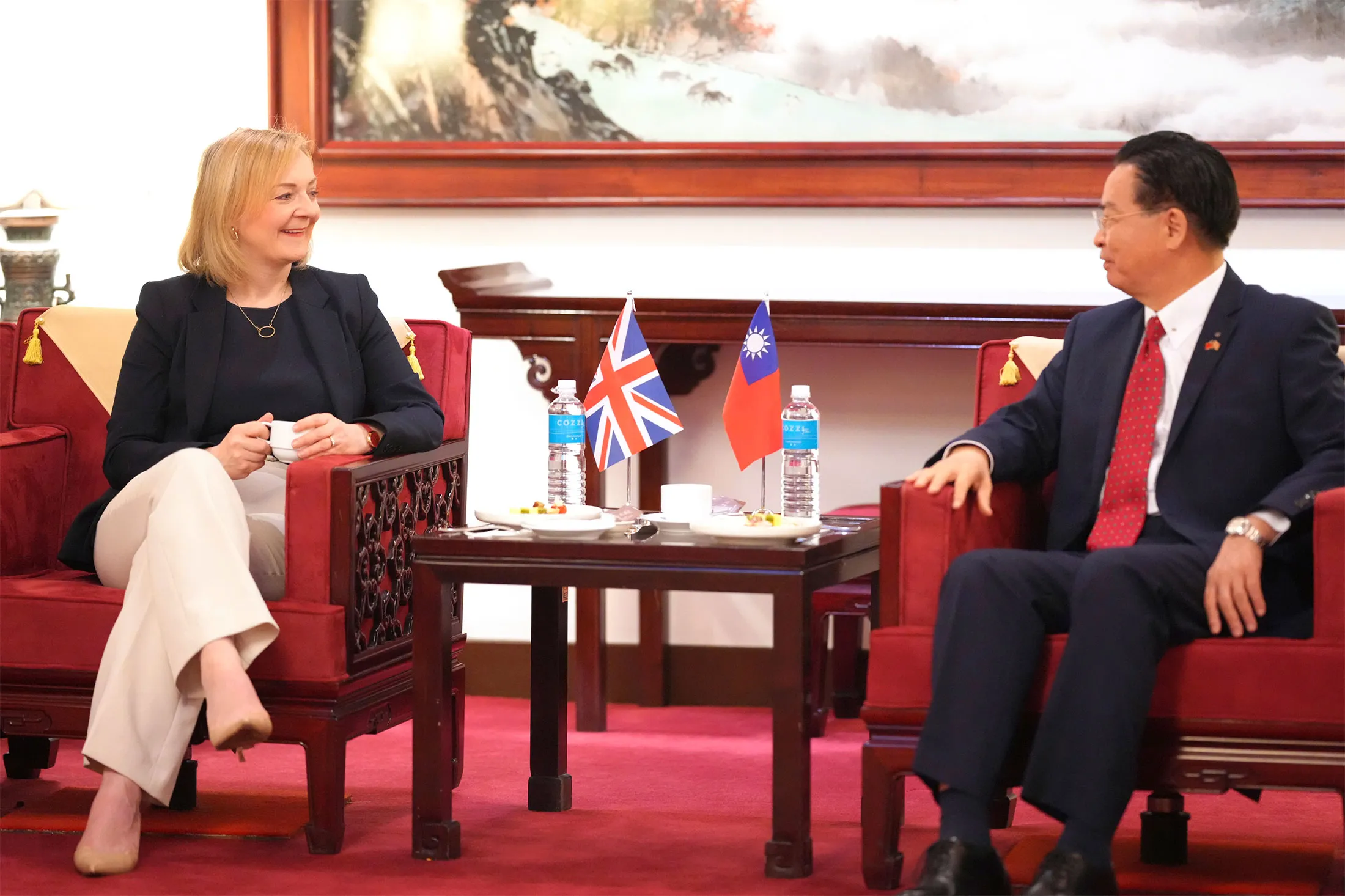 Liz Truss, left, talks with Taiwan Foreign Minister Joseph Wu upon her arrival at the Taoyuan airport in Taiwan on&nbsp;May 16.&nbsp;