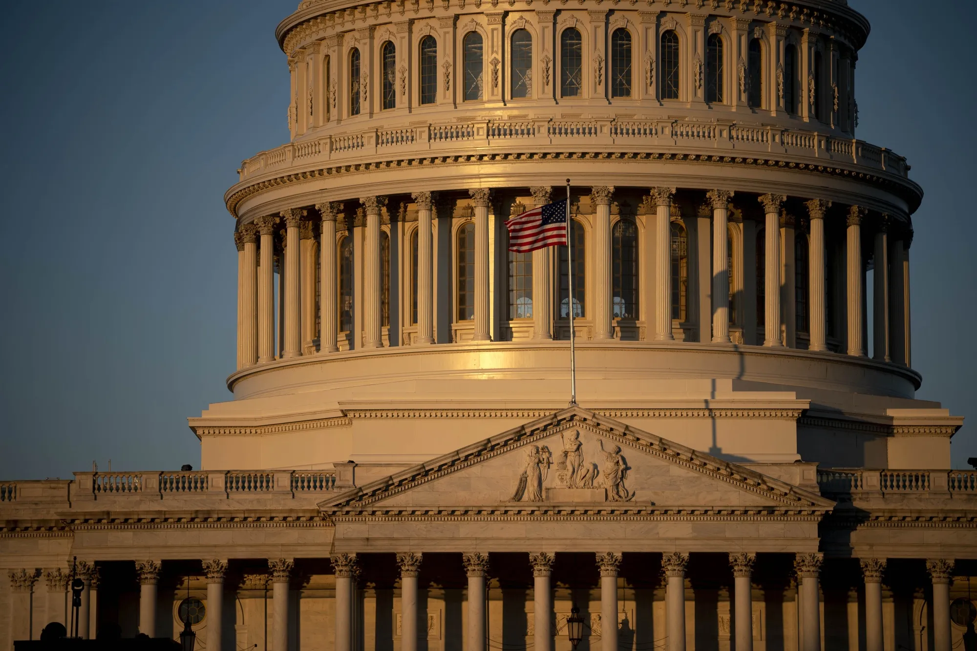 An American flag flies outside of the U.S. Capitol.