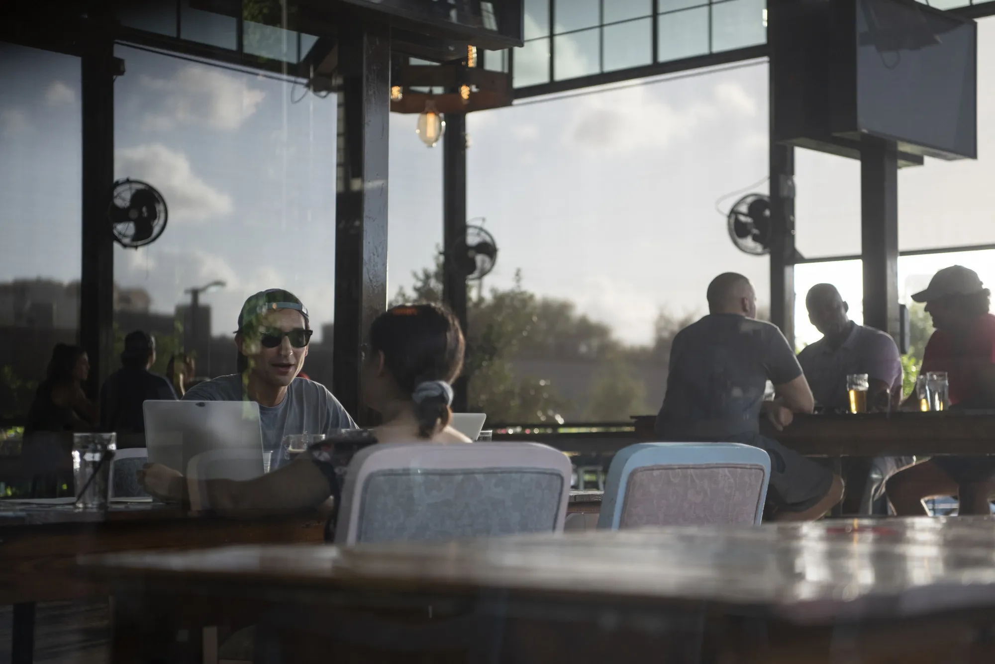 People sit inside a bar in Houston, Texas&nbsp;on&nbsp;May 23.&nbsp;