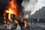 A truck burns during protests near the Arc of Triomphe on the Champs Elysees in Paris, on Nov. 24.