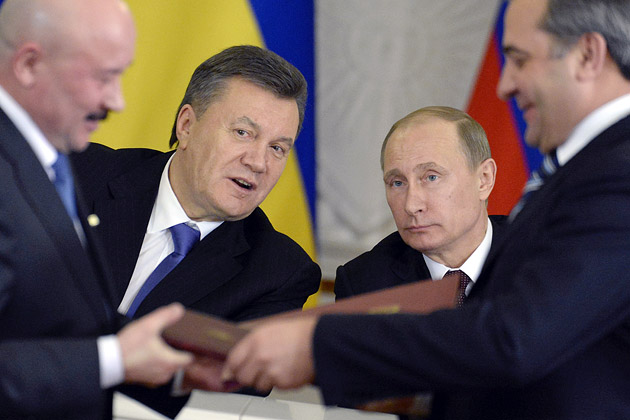 Russian President Putin (right) talks to Ukrainian President Yanukovych during a signing ceremony at the Kremlin in Moscow on Dec. 17