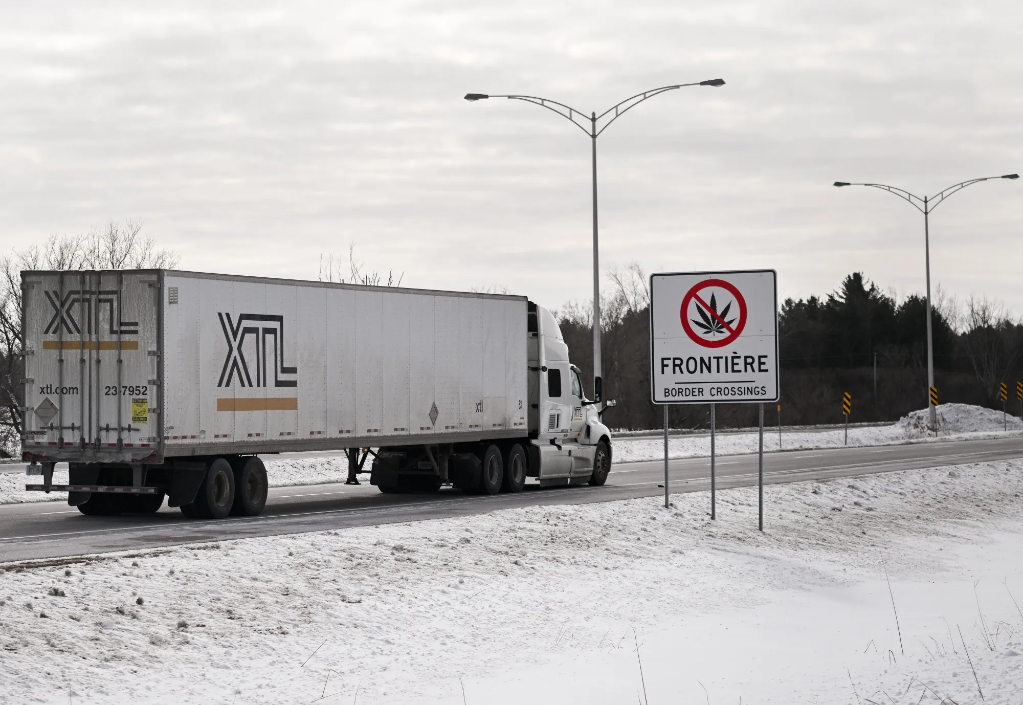 A truck drives towards the Canada-US border in Saint-Bernard-de-Lacolle, Quebec.