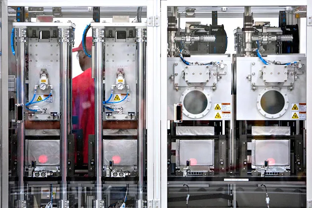 Machines are used to fabricate batteries at the A123 Systems lithium ion automotive battery manufacturing plant in Livonia, Michigan, 2010.