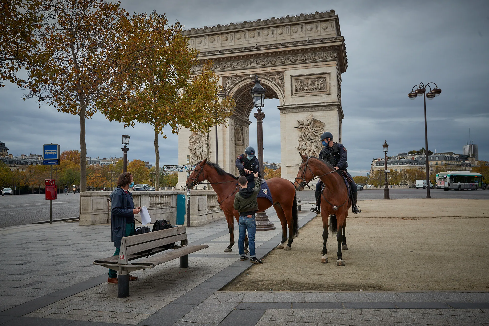 Mounted Police check people have the permission needed to leave home on the Champs Elysees on Oct.&nbsp;31.
