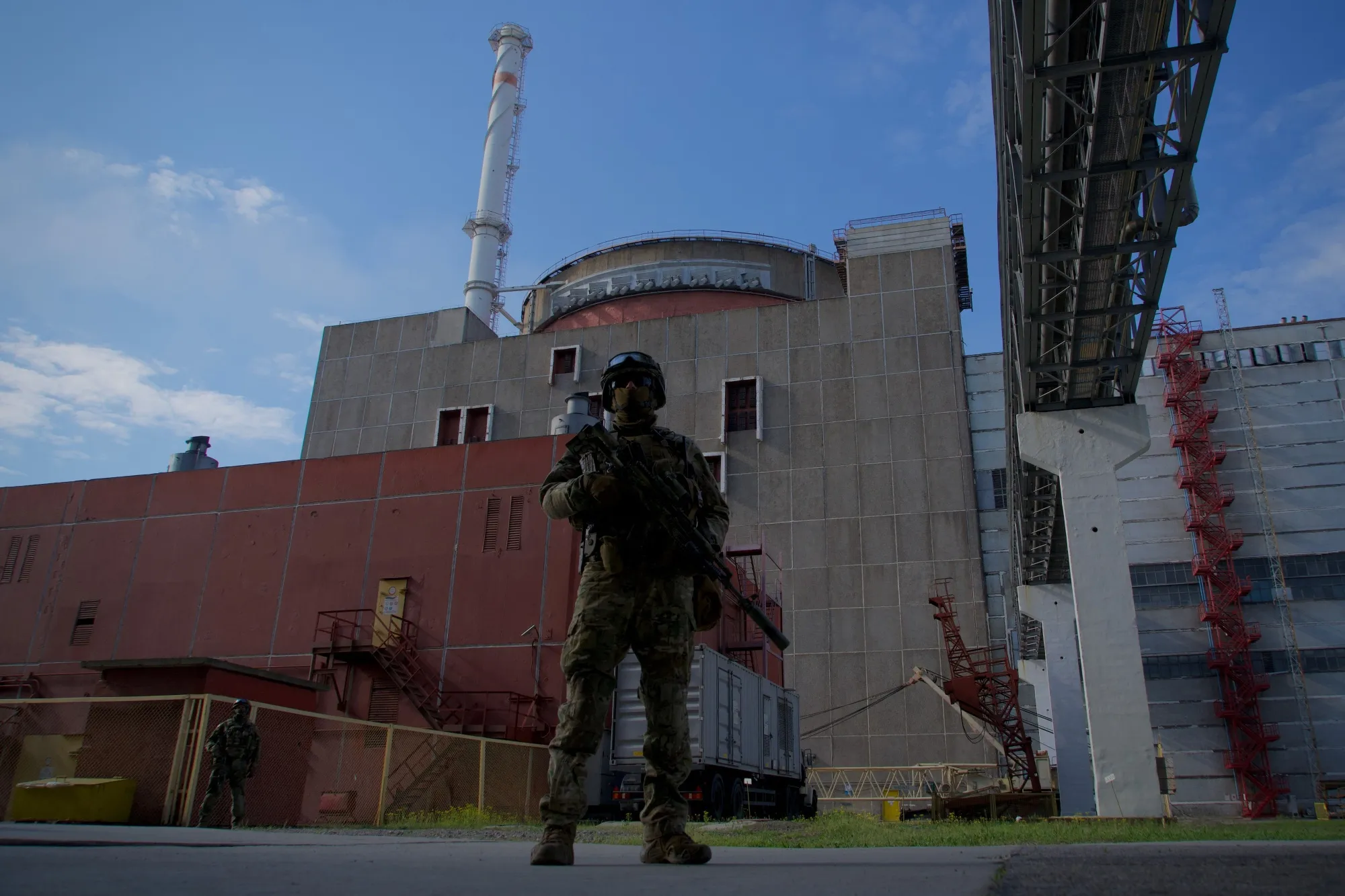 A Russian serviceman stands outside the second reactor of the Zaporizhzhia Nuclear Power Station.