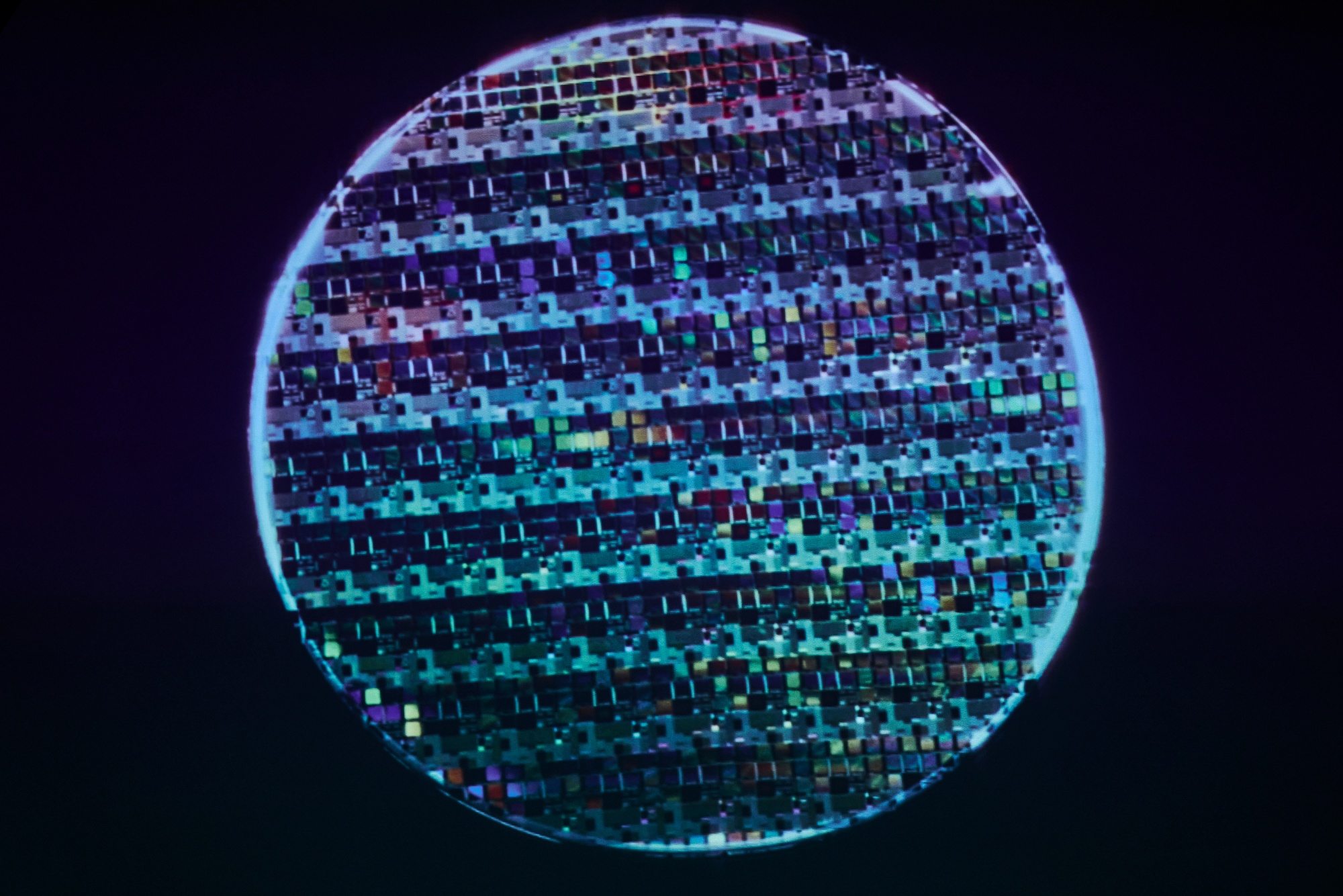 An image of a semiconductor wafer displayed at the Taiwan Semiconductor Manufacturing Co. (TSMC) Museum of Innovation in Hsinchu, Taiwan, on Tuesday, April 15, 2025. TSMC is scheduled to release earnings results on April 18. Photographer: An Rong Xu/Bloomberg