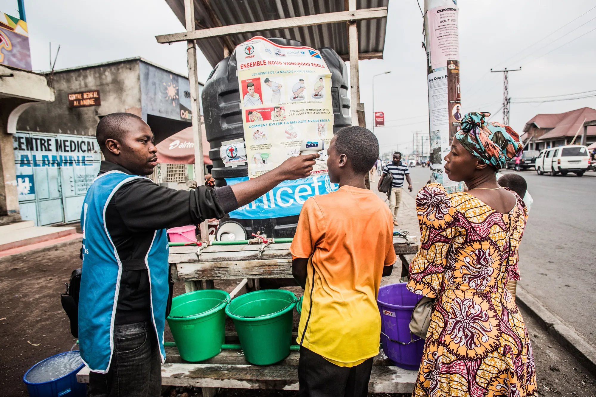 A health worker checks a boy’s temperature in Goma.