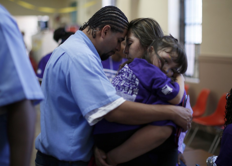 A family says goodbye after a visit at San Quentin state prison in California. Having an incarcerated parent is among the more common forms of childhood trauma in the U.S.