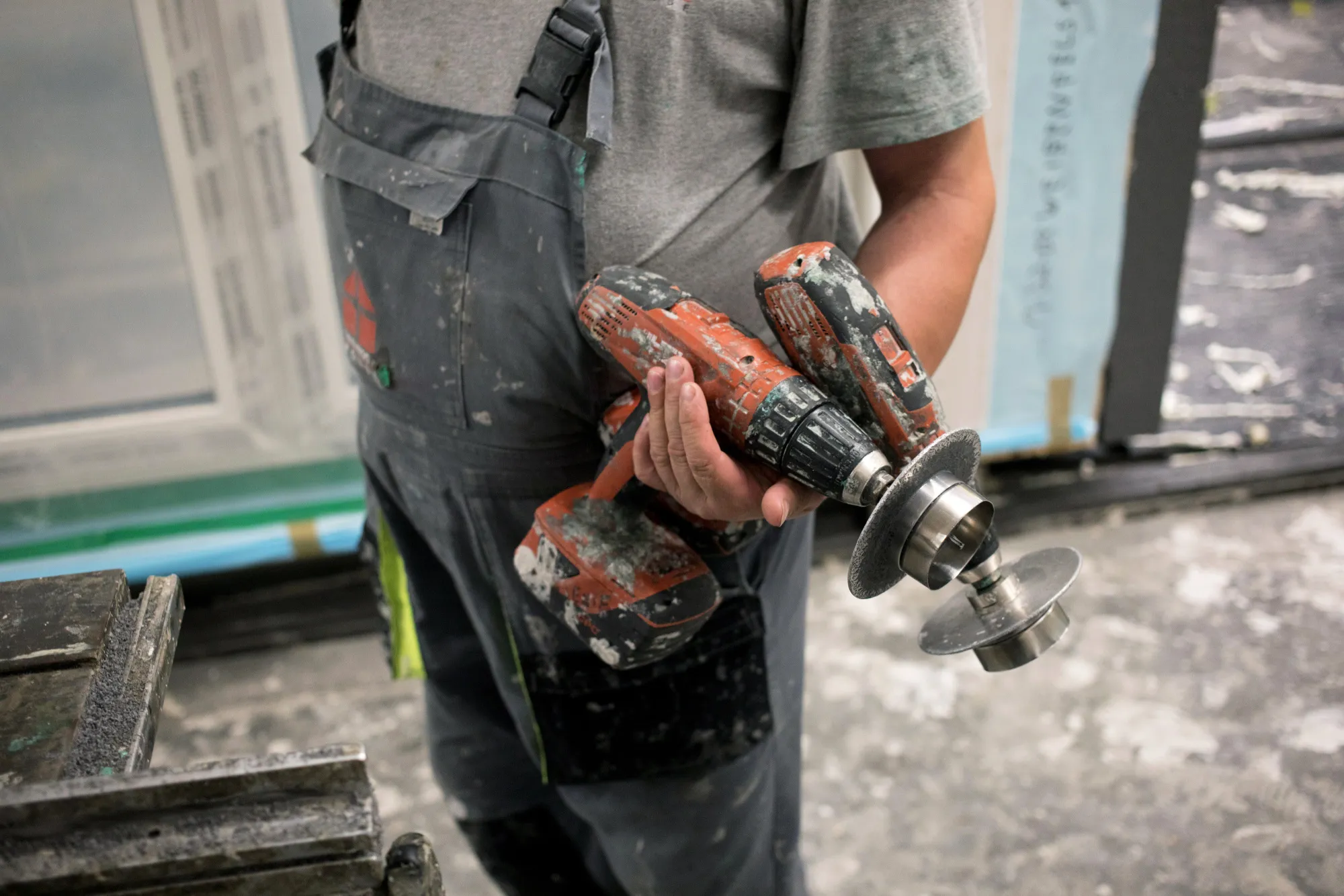 A worker holds two cordless drills while preparing wall sections for pre-fabricated homes at the Danwood SA factory in Bielsk Podlaski, Poland, on Thursday, Aug. 23, 2017. It’s the end of an era of cheap and ample labor that underpinned their transition from communism, with growing complaints that a labor dearth is threatening to foil production plans.