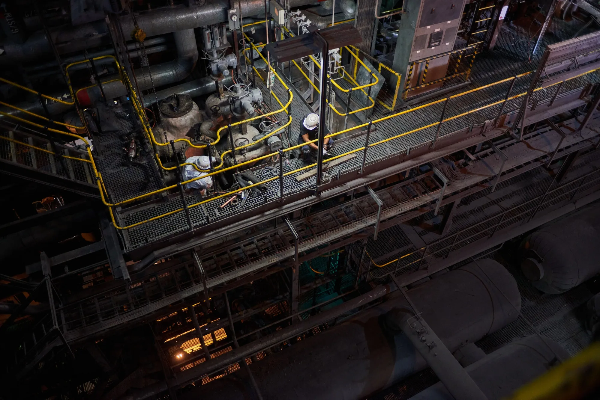 Workers carry out repairs on machinery at the Eskom Holdings SOC Ltd. Tutuka coal-fired power station in Mpumalanga, South Africa.