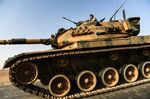A Turkish army tank drives towards Syria in the Turkish-Syrian border city of Karkamis, in the southern region of Gaziantep on Aug. 24, 2016.
