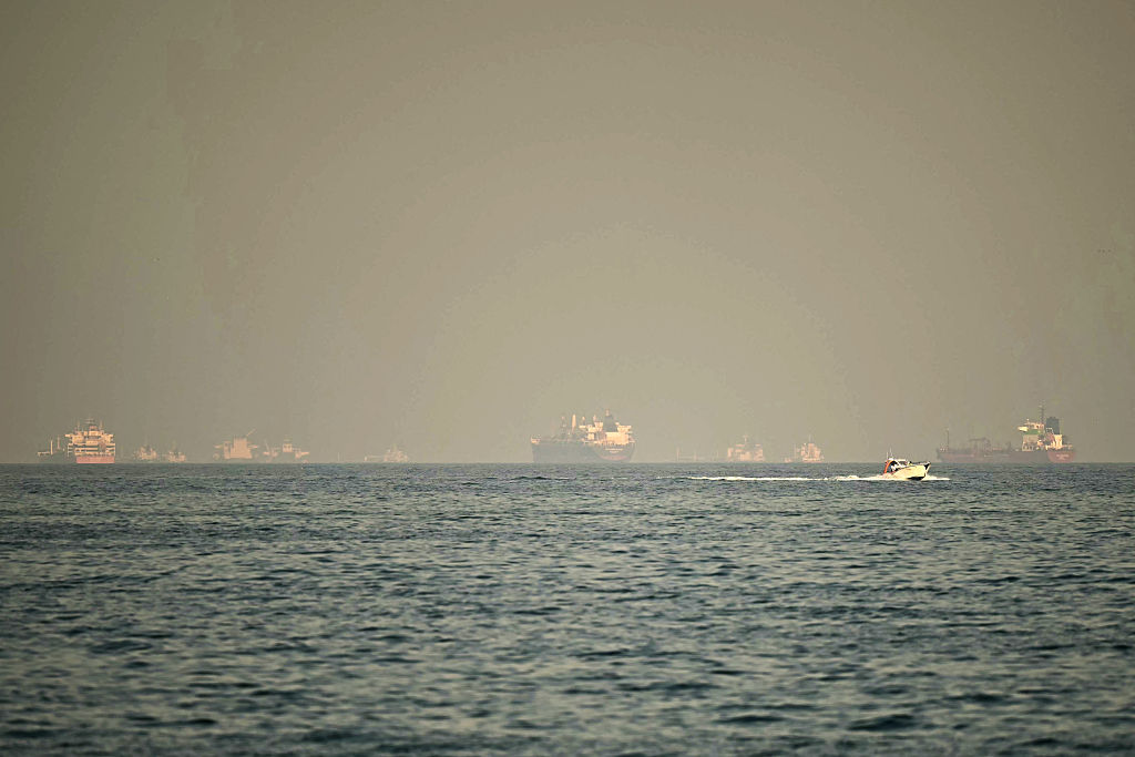 TOPSHOT - Cargo ships and tankers are seen off coast city of Fujairah, in the Strait of Hormuz in the northern Emirate on February 25, 2026. (Photo by Giuseppe CACACE / AFP via Getty Images)