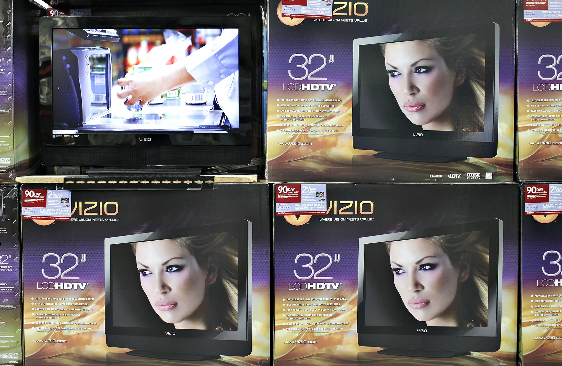 Vizio flat screen televisions sit on display inside a CostCo store in Queens, New York, U.S., on Thursday, May 28, 2009. Costco Wholesale Corp., the largest U.S. warehouse-club chain, said third-quarter profit fell 29 percent after consumers cut spending, the company incurred a charge for litigation and a higher dollar hurt overseas sales.
