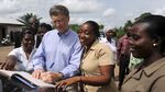Bill Gates signs visitor's register at the Ahentia Health Centre in the Awutu Senya district, central region in Ghana on March 26, 2013.
