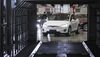A Tesla Model X sports utility vehicle (SUV) drives into a rain testing chamber during assembly for the European market at the Tesla Motors Inc. factory in Tilburg, Netherlands, on Friday, Dec. 9, 2016. A boom in electric vehicles made by the likes of Tesla could erode as much as 10 percent of global gasoline demand by 2035, according to the oil industry consultant Wood Mackenzie Ltd.