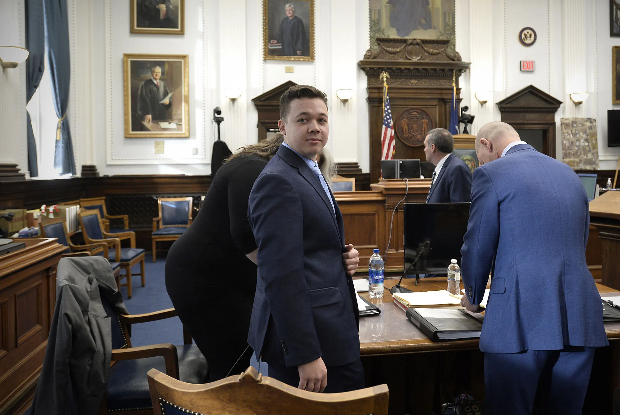 Kyle Rittenhouse, center, makes his way to his seat at the Kenosha County Courthouse in Kenosha, Wisconsin on Nov. 15.