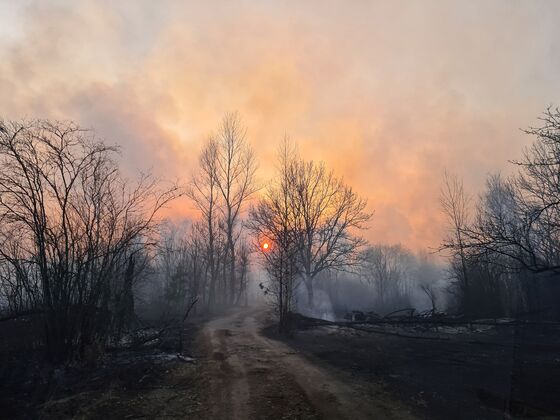 Ukraine Firefighters Battle Brush Fire Near Chernobyl Plant
