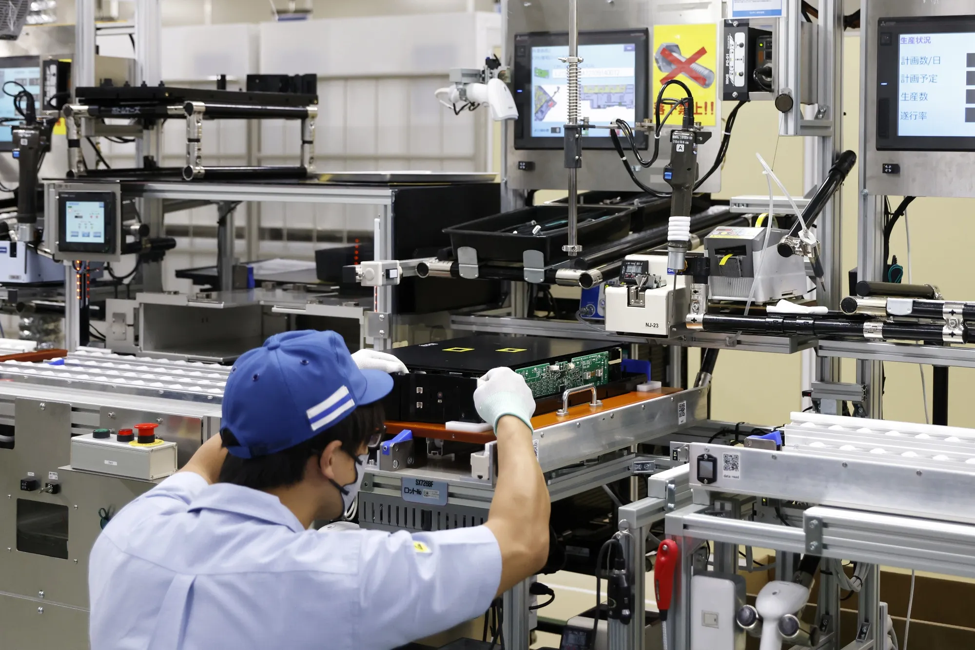 An employee assembles a module at a battery plant in Fukui Prefecture.
