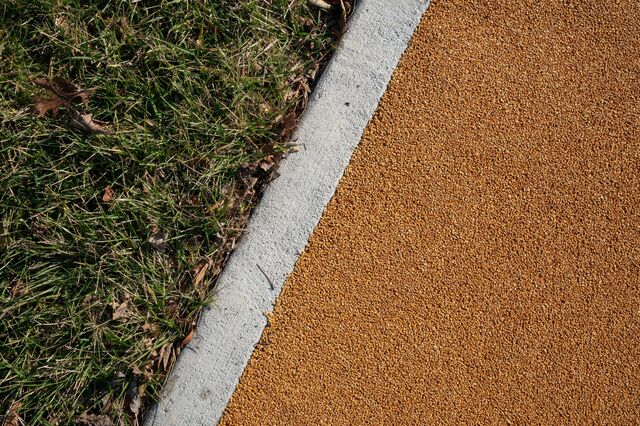  A closeup photograph of the safety surface, a permeable and recyclable cork product, at the Anna C. Verna Playground.