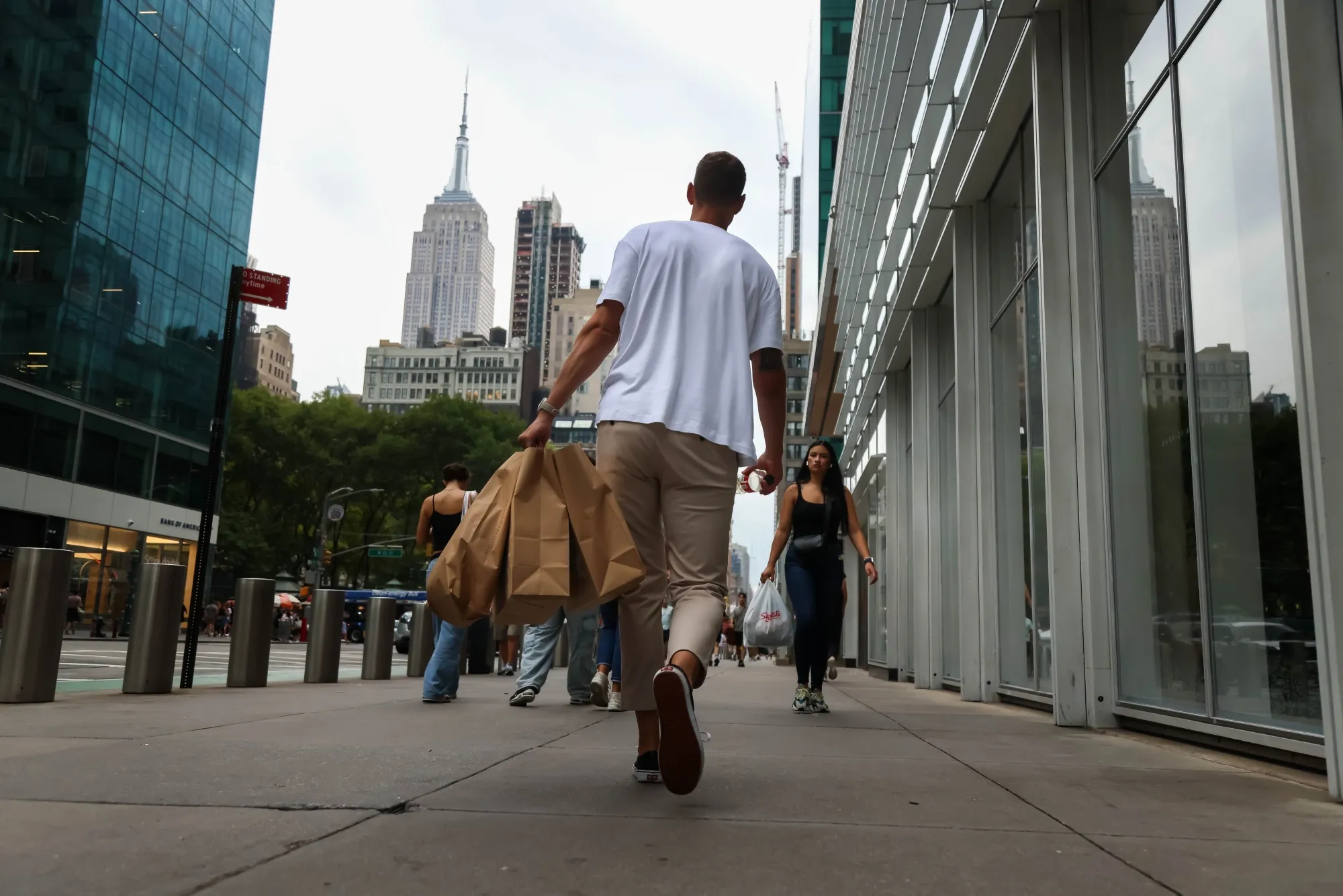 A shopper carries bags in New York,&nbsp;on&nbsp;Sept. 6.