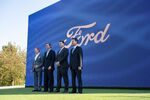 Bill Ford, chairman of Ford Motor Co., from left, Andy Beshear, governor of Kentucky, James Farley, CEO of Ford Motor Co., and Dong Seob Jee, CEO of SK Innovation, at a Ford announcement in Frankfort, Kentucky, Sept. 28, 2021.