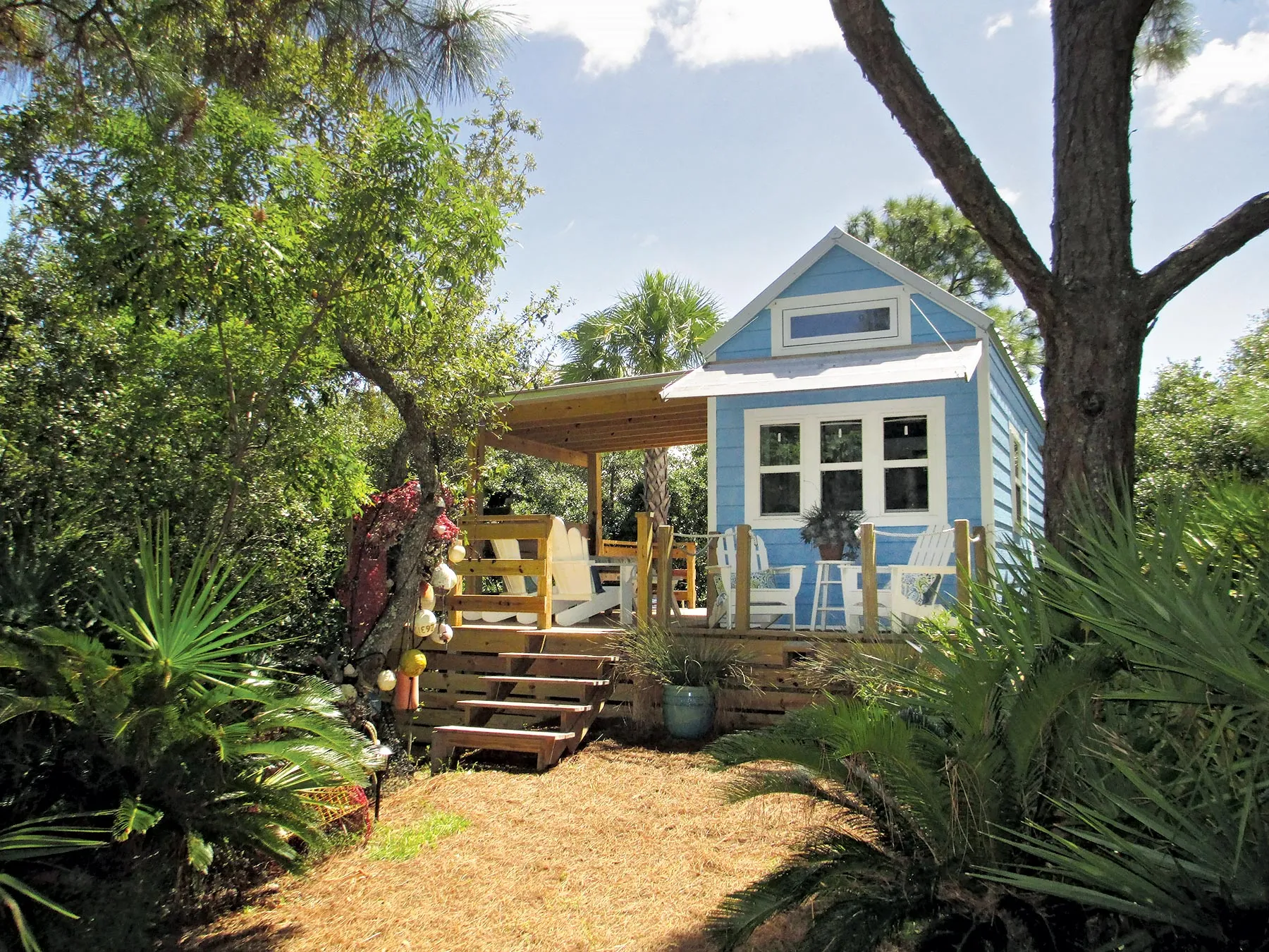 $63,700: St. George Island, Fla., 325-sq.-ft. beachside getaway! Lovely front porch perfect for (small) parties.
