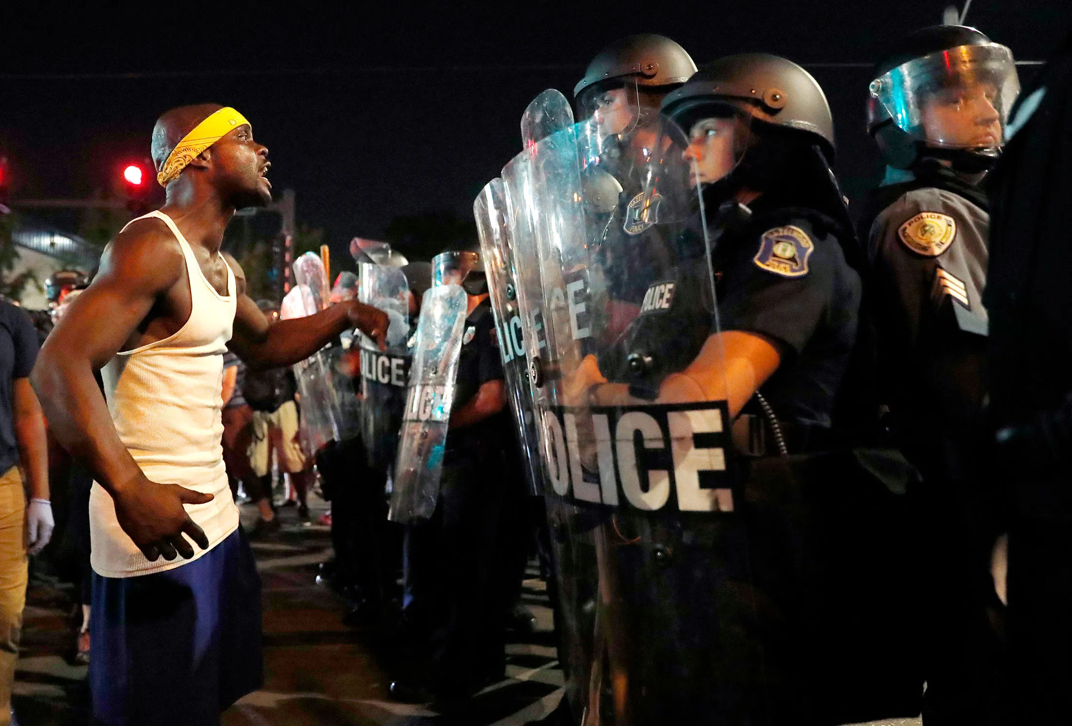 A man yells at police in riot gear before a crowd turned violent on Sept. 16.
