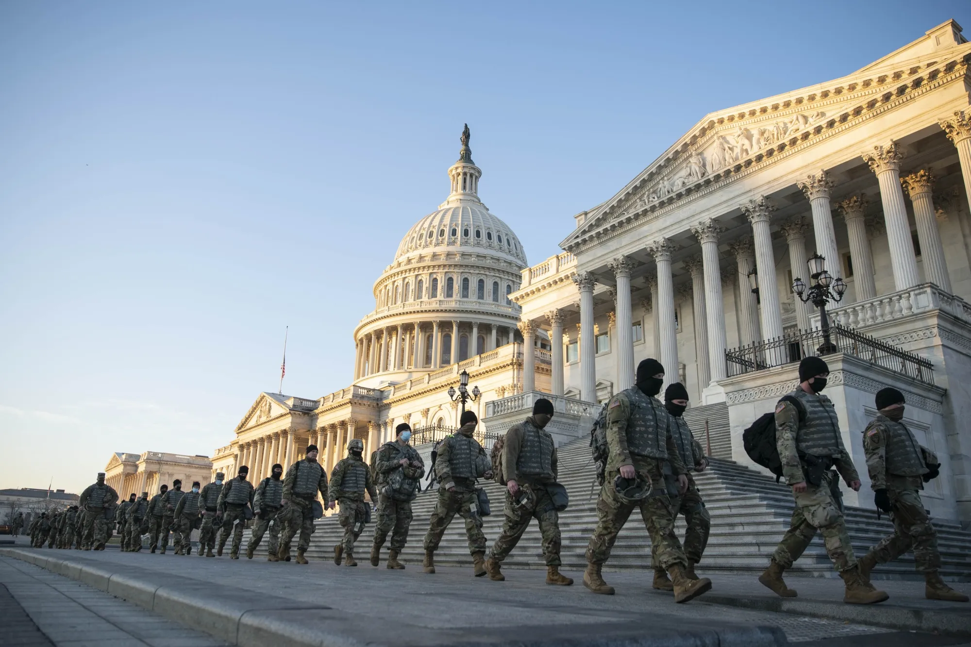 Members of the National Guard walk outside of the U.S. Capitol building in Washington, D.C., on&nbsp;Jan. 13.