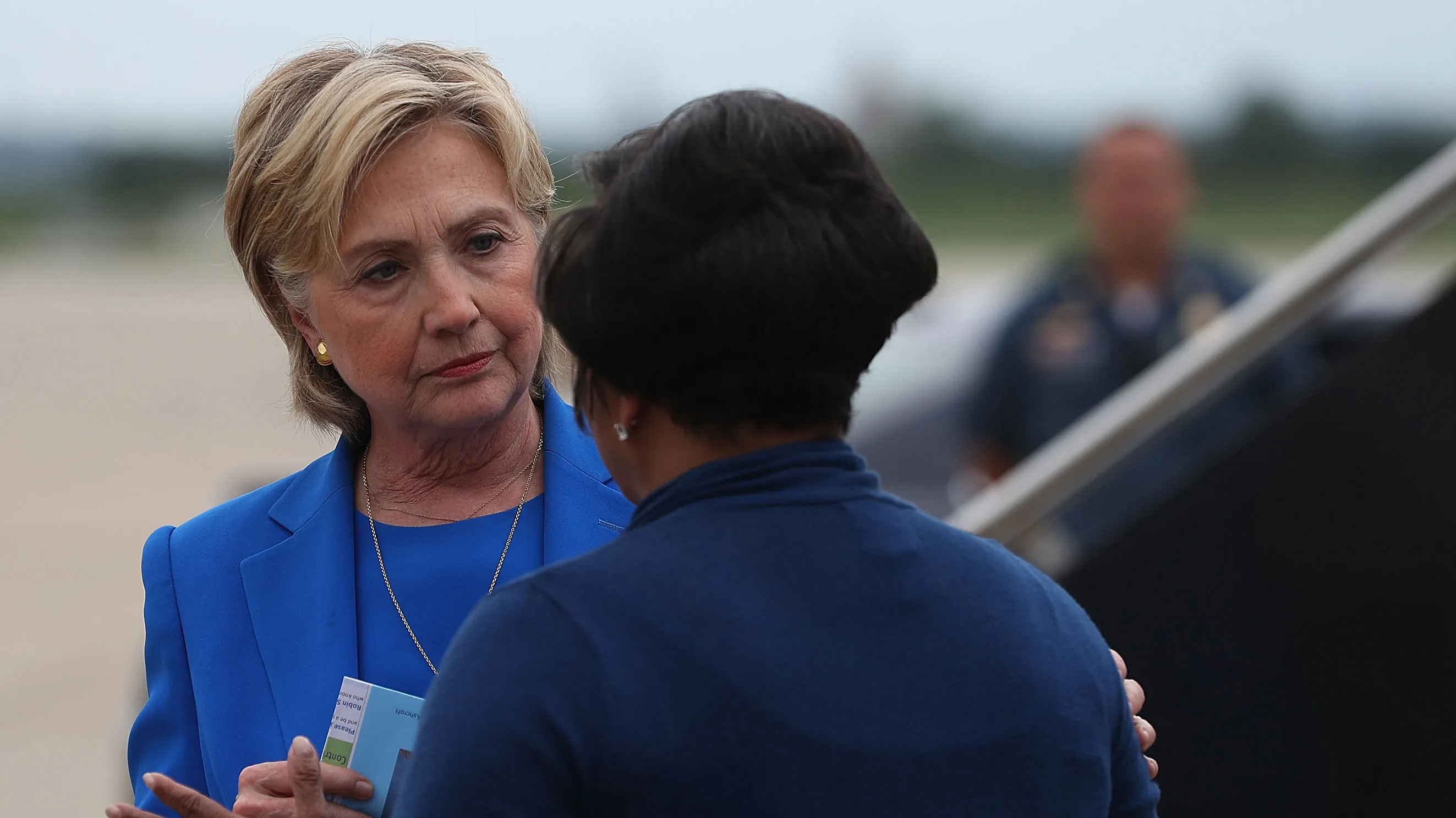 Democratic presidential nominee Hillary Clinton greets a supporter after walking off of her campaign plane at Charles B. Wheeler Downtown Airport on September 8, 2016 in Kansas City, Missouri.
