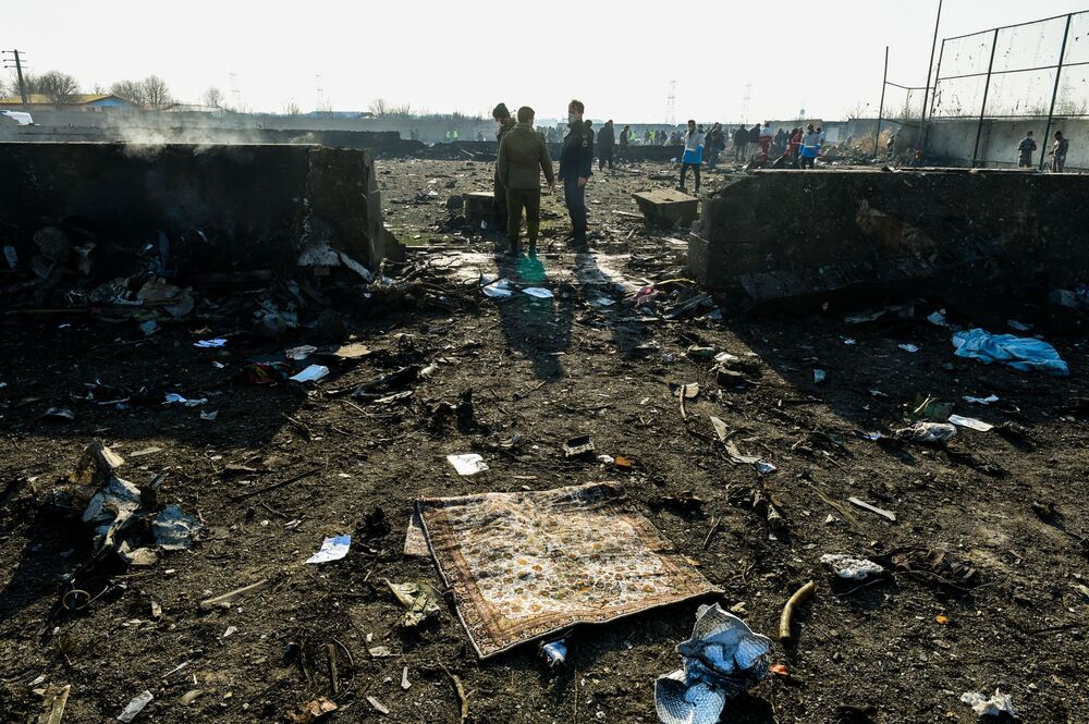 Debris from the wreckage of a Boeing 737-800 aircraft, operated by Ukraine International Airlines, which crashed shortly after takeoff covers the site near Shahedshahr, Iran on Jan. 8, 2020.